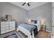 Cozy bedroom with a bed, wood floor, ceiling fan, and area rug at 271 Lockhard Cir, Troutman, NC 28166