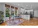 Bright breakfast nook featuring natural light, hardwood floors, and a view to the backyard at 271 Lockhard Cir, Troutman, NC 28166