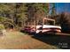 Stacked canoes in a rack near the fishing dock by the lake, perfect for outdoor enthusiasts at 271 Lockhard Cir, Troutman, NC 28166
