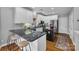 Kitchen featuring granite countertops, white cabinetry, a kitchen island, and stainless steel appliances at 271 Lockhard Cir, Troutman, NC 28166