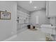 Well-organized laundry room with plenty of shelving, a sink, and storage space at 271 Lockhard Cir, Troutman, NC 28166