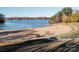 Sandy beach at Lake Norman featuring lake views and a swim area, ideal for lakefront living at 271 Lockhard Cir, Troutman, NC 28166
