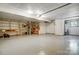 Spacious basement with bright lighting, storage shelves, and a neutral painted floor at 11429 Spreading Oak Ln, Charlotte, NC 28226