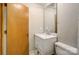 A modern bathroom vanity with white cabinets and a marble countertop, complemented by neutral walls at 11429 Spreading Oak Ln, Charlotte, NC 28226