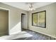 Bedroom with a closet, new carpet, neutral walls, and a large window with a beautiful wooded view at 11429 Spreading Oak Ln, Charlotte, NC 28226