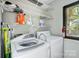 Spacious laundry room with shelving and washer dryer, offering functionality and ample storage at 11429 Spreading Oak Ln, Charlotte, NC 28226