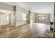 Open floor plan with view of the kitchen and adjacent sunroom filled with natural light at 11429 Spreading Oak Ln, Charlotte, NC 28226