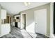 Open-concept living area features a kitchen, adjacent to an entry way, and stairway at 11429 Spreading Oak Ln, Charlotte, NC 28226