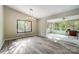 Open-concept living space showcasing natural light and seamless flow into the sunroom at 11429 Spreading Oak Ln, Charlotte, NC 28226