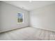 Spacious bedroom with carpeted floors and a window at 117 Jentri Way, Mooresville, NC 28115