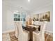Dining room with a dark wood table, neutral chairs and large window at 117 Jentri Way, Mooresville, NC 28115