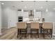 Modern kitchen with white cabinets, stainless steel appliances, and an island at 117 Jentri Way, Mooresville, NC 28115