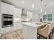 Spacious kitchen with white cabinets, stainless steel appliances and large island at 117 Jentri Way, Mooresville, NC 28115