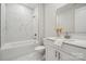 Modern bathroom with white cabinets, marble tile, and a large mirror at 121 Jentri Way, Mooresville, NC 28115