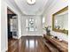 Elegant entryway featuring hardwood floors, a large mirror, and French doors at 18719 Bartlette Creek Dr, Davidson, NC 28036