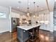 Spacious kitchen featuring stainless steel appliances and a large island at 18719 Bartlette Creek Dr, Davidson, NC 28036