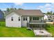 Expansive backyard with a patio, firepit area, and lush green lawn, perfect for outdoor living at 4116 Spring Cove Way, Belmont, NC 28012