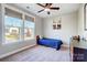 Bedroom featuring a twin bed, two large windows and a ceiling fan at 4116 Spring Cove Way, Belmont, NC 28012