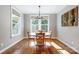 Bright dining room featuring hardwood floors, natural light, and a modern chandelier at 4116 Spring Cove Way, Belmont, NC 28012