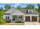 Charming craftsman home featuring a welcoming front porch and attached two-car garage at 4116 Spring Cove Way, Belmont, NC 28012