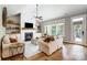 Cozy living room with a fireplace, built-in shelves, hardwood floors, and a comfortable seating arrangement at 4116 Spring Cove Way, Belmont, NC 28012