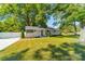 Charming ranch home with a well-manicured lawn and white picket fence at 3728 Craig Ave, Charlotte, NC 28211