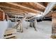 Unfinished basement with exposed brick and pipes at 410 E Arch St, Lancaster, SC 29720