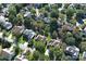 An aerial view of a neighborhood of homes surrounded by mature trees at 6416 Red Maple Dr, Charlotte, NC 28277