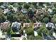 Aerial view of a home with a large yard, mature trees, and a two car garage at 6416 Red Maple Dr, Charlotte, NC 28277