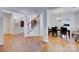 An open floor plan with foyer leading into a dining room, a staircase, and a view of the interior decor at 6416 Red Maple Dr, Charlotte, NC 28277
