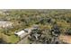 Neighborhood aerial view showcasing a home's location among mature trees and nearby buildings at 5303 Shasta Hill Ct, Charlotte, NC 28211
