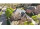 Aerial view of a spacious brick home with a well-manicured lawn and mature trees at 5303 Shasta Hill Ct, Charlotte, NC 28211