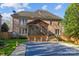 A home's exterior reveals a screened porch and pool, creating a serene backyard retreat at 5303 Shasta Hill Ct, Charlotte, NC 28211