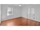 Bright bedroom boasting hardwood floors and French doors to balcony at 5303 Shasta Hill Ct, Charlotte, NC 28211