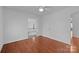 Bright bedroom featuring hardwood floors, a ceiling fan, and natural light at 5303 Shasta Hill Ct, Charlotte, NC 28211