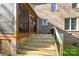 Backyard featuring a screened-in porch with access to the deck and grassy lawn at 5303 Shasta Hill Ct, Charlotte, NC 28211