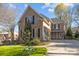 Well-maintained brick home with mature landscaping and a circular driveway at 5303 Shasta Hill Ct, Charlotte, NC 28211