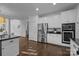 Modern kitchen featuring stainless steel appliances, a large refrigerator and an open layout at 5303 Shasta Hill Ct, Charlotte, NC 28211