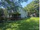 This home features a spacious yard with mature trees and a screened in back porch at 602 W Council St, Salisbury, NC 28144