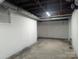 Unfinished basement with white walls and visible ceiling pipes at 602 W Council St, Salisbury, NC 28144