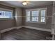 Bright bedroom featuring large windows and modern flooring, a serene retreat at 602 W Council St, Salisbury, NC 28144