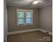 Bedroom with carpeted floor, grey walls and white trim and one window at 602 W Council St, Salisbury, NC 28144