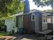 Shingled home with brick chimney and mature trees in a wooded location at 602 W Council St, Salisbury, NC 28144