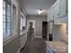 Bright kitchen featuring granite countertops, stainless sink, and gray wood-look flooring at 602 W Council St, Salisbury, NC 28144