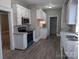 Updated kitchen with granite countertops, modern appliances, and abundant storage at 602 W Council St, Salisbury, NC 28144