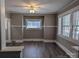 Well-lit living room boasts new flooring and neutral tones, perfect for relaxation at 602 W Council St, Salisbury, NC 28144