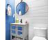 Stylish powder room with a gray vanity and shiplap walls at 112 Sugar Thyme Ln, Mooresville, NC 28115