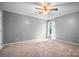 Neutral bedroom with gray walls, carpeted floors, and a window at 112 Sugar Thyme Ln, Mooresville, NC 28115