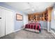 Serene bedroom with built-in bookshelves and double closets at 112 Sugar Thyme Ln, Mooresville, NC 28115