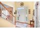 Bright entryway with a large front door and decorative accents at 112 Sugar Thyme Ln, Mooresville, NC 28115